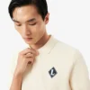 「Made in France」バッジをあしらったポロシャツカラーセーター 「Made in France」バッジをあしらったポロシャツカラーセーター