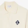 「Made in France」バッジをあしらったポロシャツカラーセーター 「Made in France」バッジをあしらったポロシャツカラーセーター