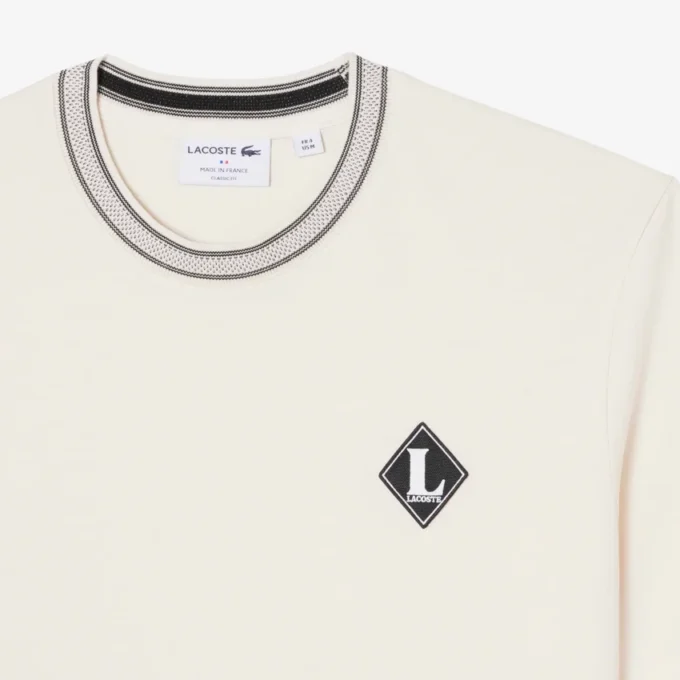 「Made in France」バッジをあしらったTシャツ 「Made in France」バッジをあしらったTシャツ