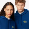 ユニセックス ルーズフィット バッジアクセント フーディー ユニセックス ルーズフィット バッジアクセント フーディー