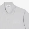 クラシックフィットのエンボス加工ロゴ入りポロシャツ クラシックフィットのエンボス加工ロゴ入りポロシャツ