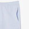 エンボス加工のロゴ入りスウェットパンツ