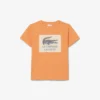 バッジがアクセントのコットンTシャツ