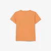 バッジがアクセントのコットンTシャツ