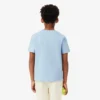 バッジがアクセントのコットンTシャツ
