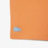 バッジがアクセントのコットンTシャツ